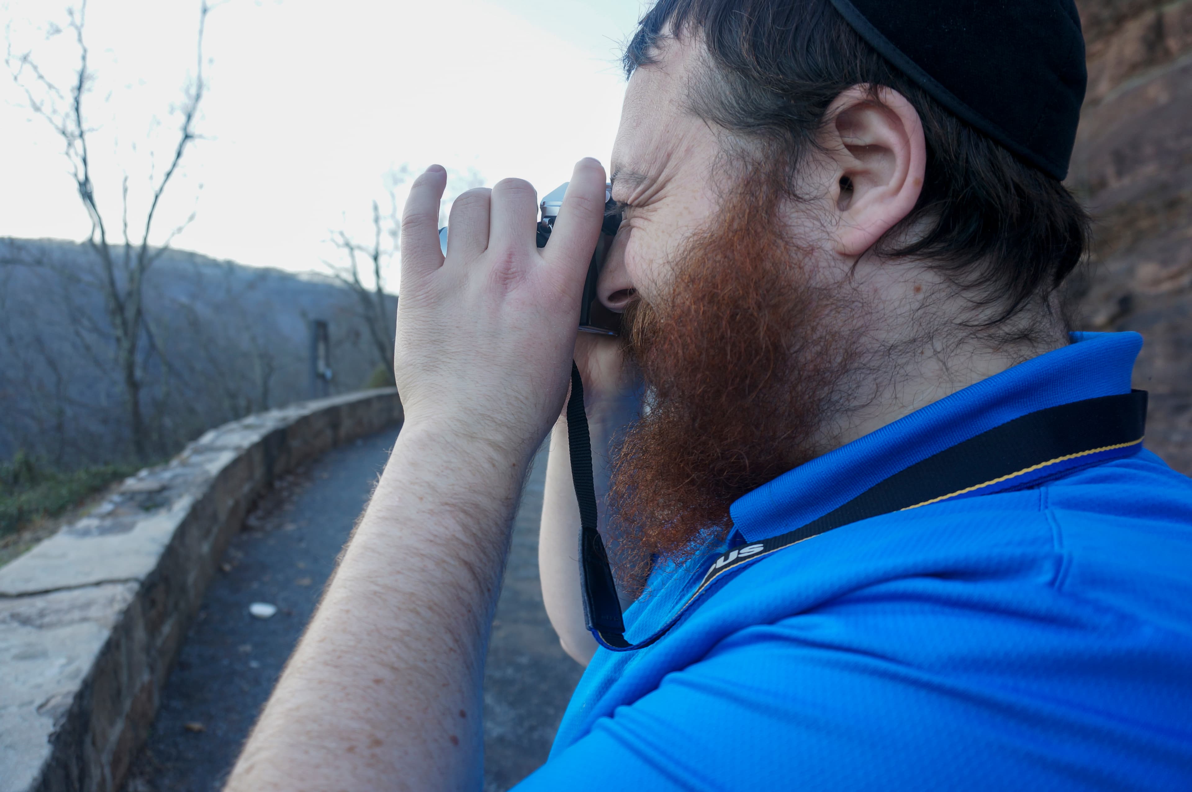 Matis Fogel photographing a wooded overlook
